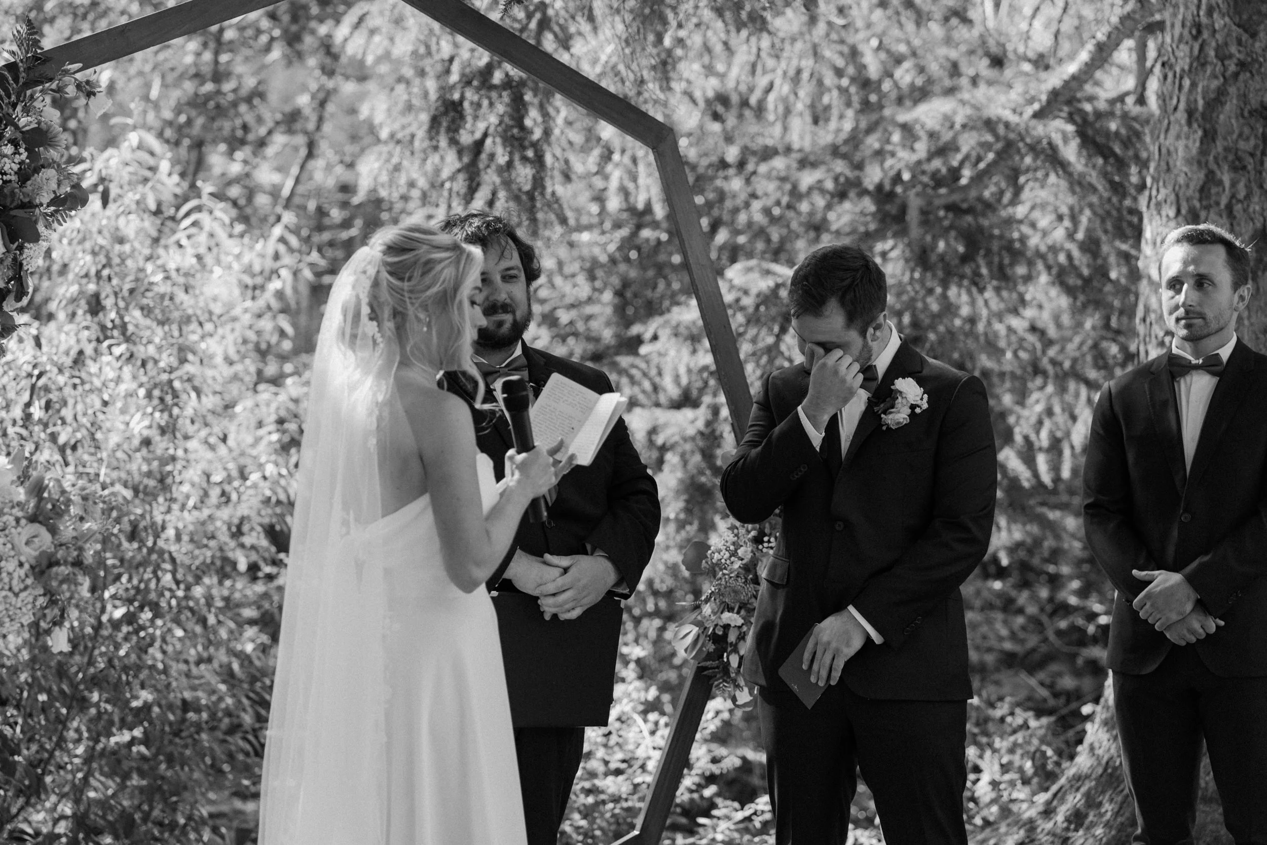 groom crying during bride's vows on wedding day at Blackstone Rivers Ranch