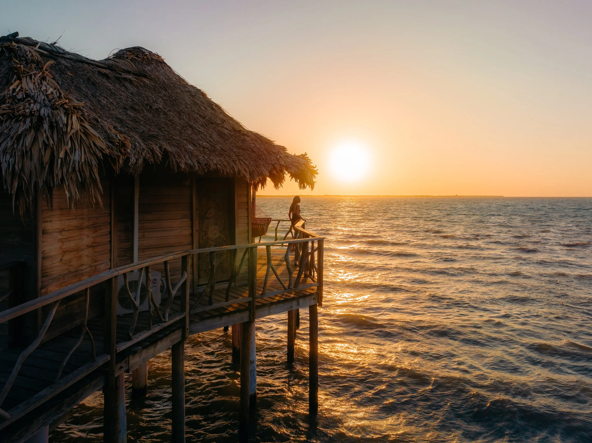 Thatch Caye Premier Overwater Bungalow Sunset View.jpg