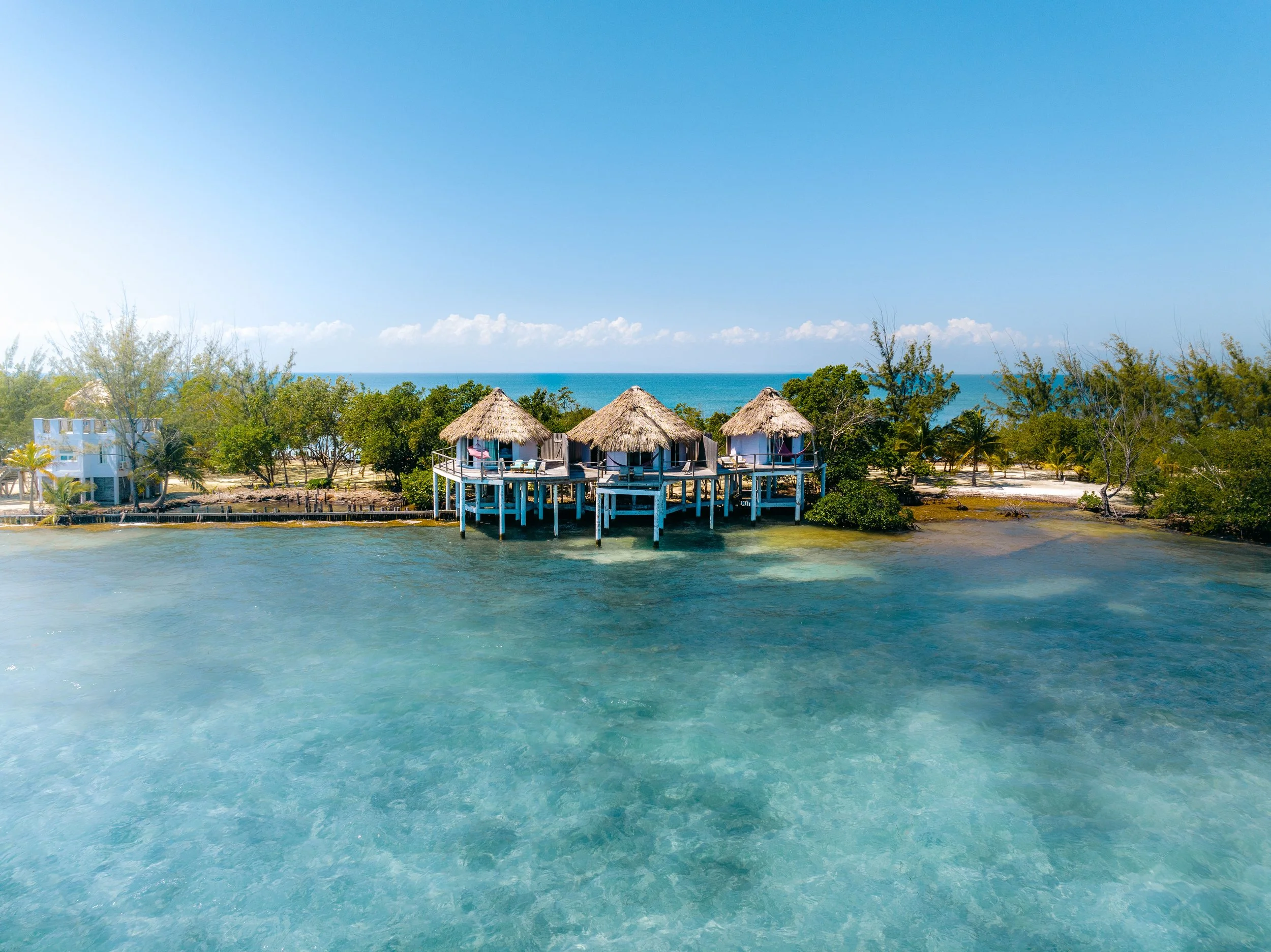 Thatch Caye Overwater Bungalow Group.jpg