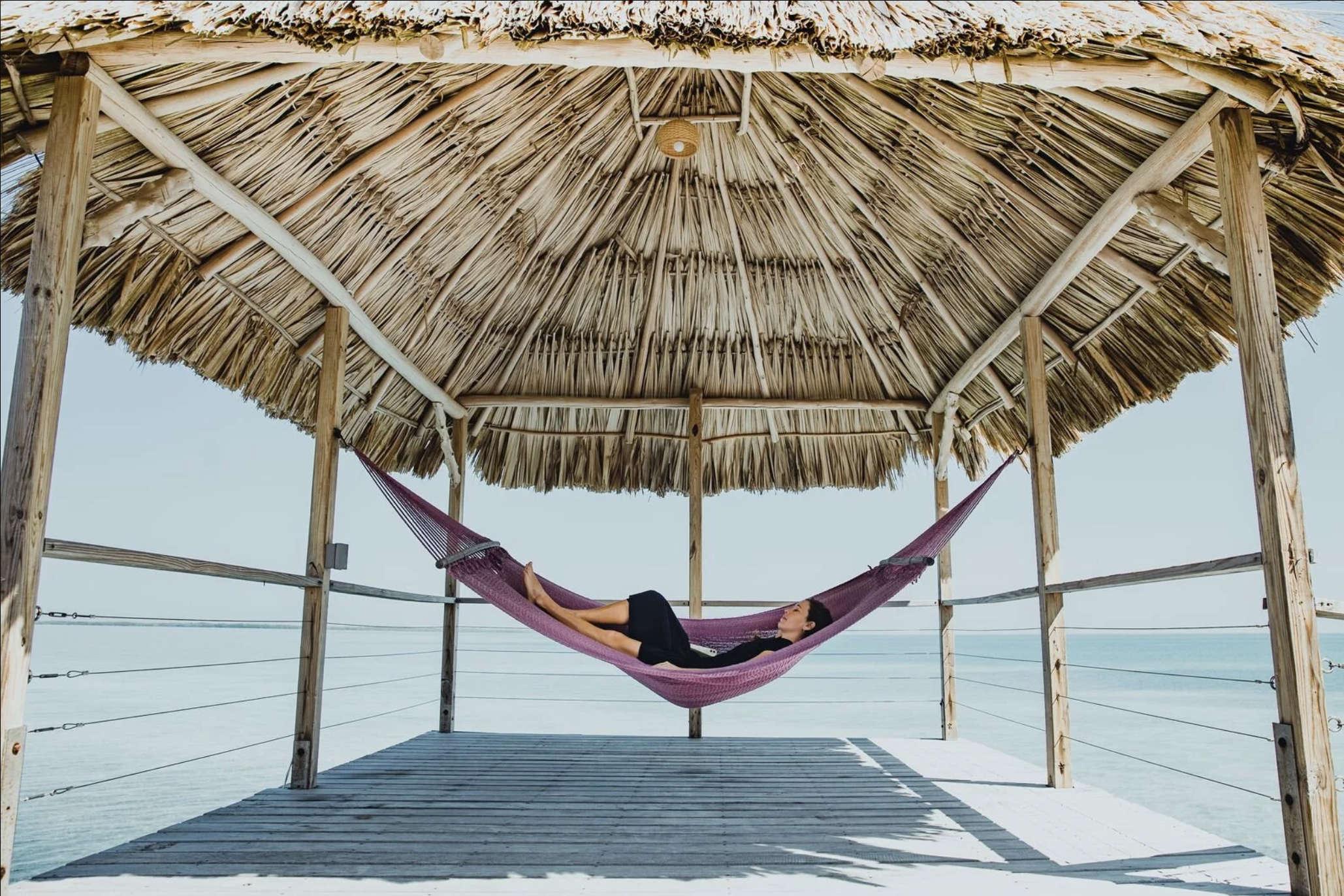 Thatch Caye Overwater Bungalow Hammock.png