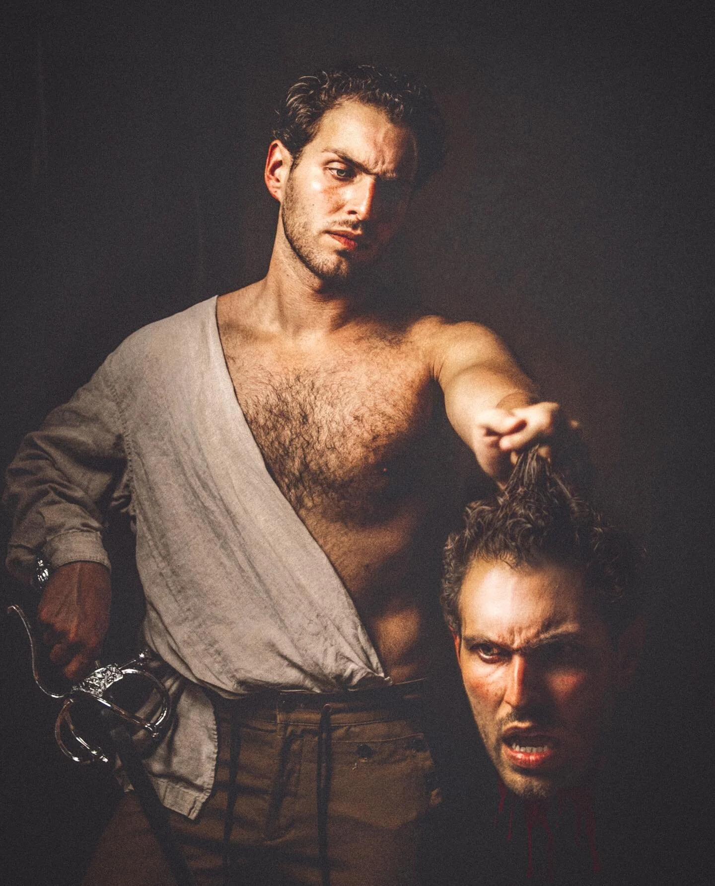 Self-Portrait as Caravaggio's &quot;David with the Head of Goliath&quot; // Where Michelangelo&rsquo;s &ldquo;David&rdquo; is a stately, poised study of the biblical figure, triumphant after slaying his rival Goliath, sling in hand and sitting on his