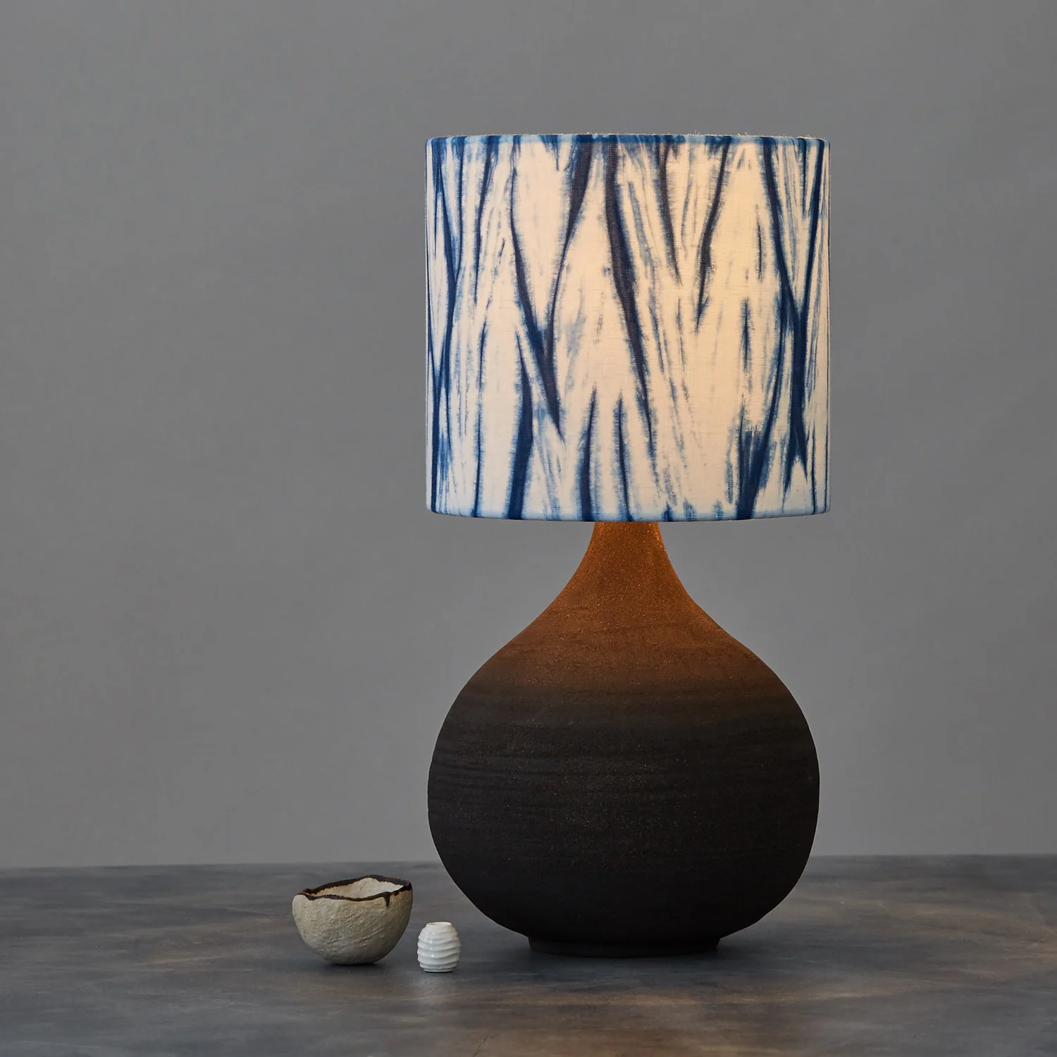 Indigo blue arashi striped shibori lampshade - table lamp lit