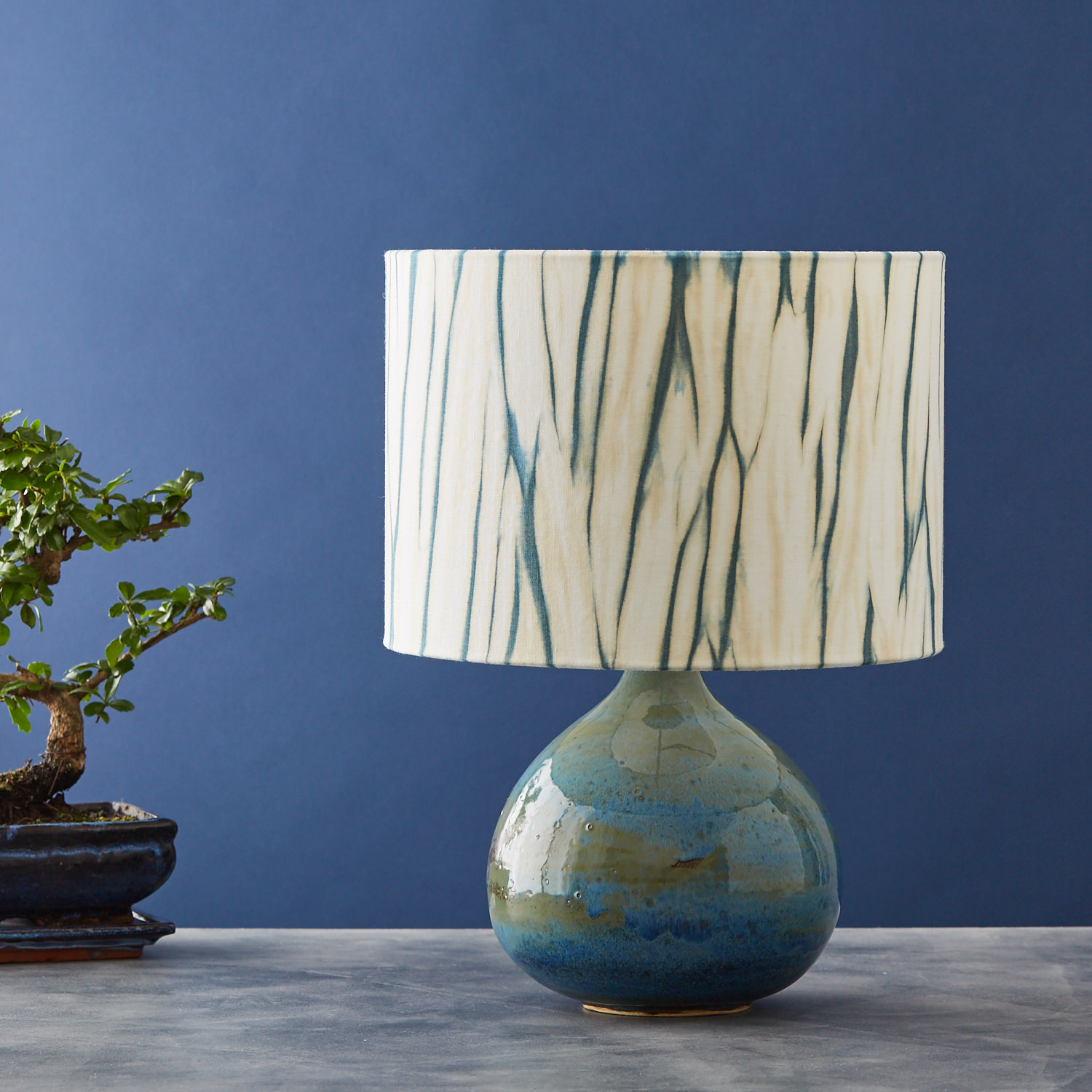 Teal green and gold arashi striped shibori lampshade - table lamp unlit medium