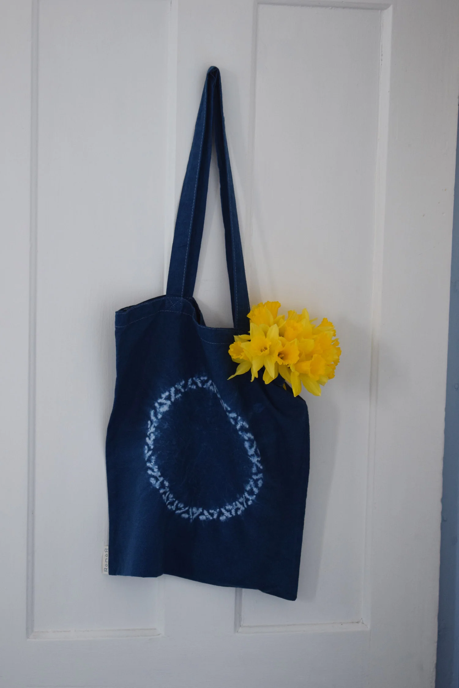 Romor Designs indigo tote - NIMBUS - NINBASU - hanging on door.jpg