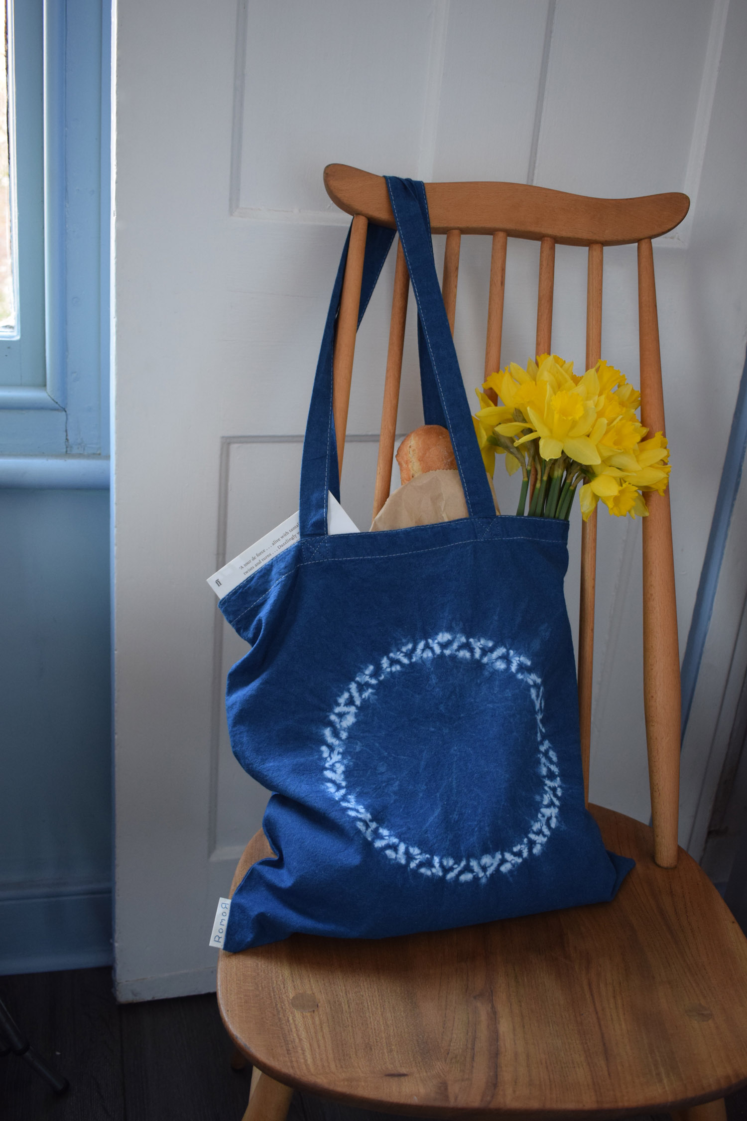 Romor Designs indigo tote - NIMBUS - NINBASU - on chair filled.jpg