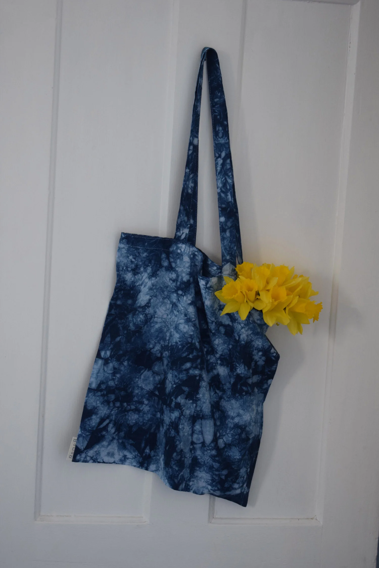 Romor Designs indigo tote - MARBLING - BOMAKI - hanging on door.jpg