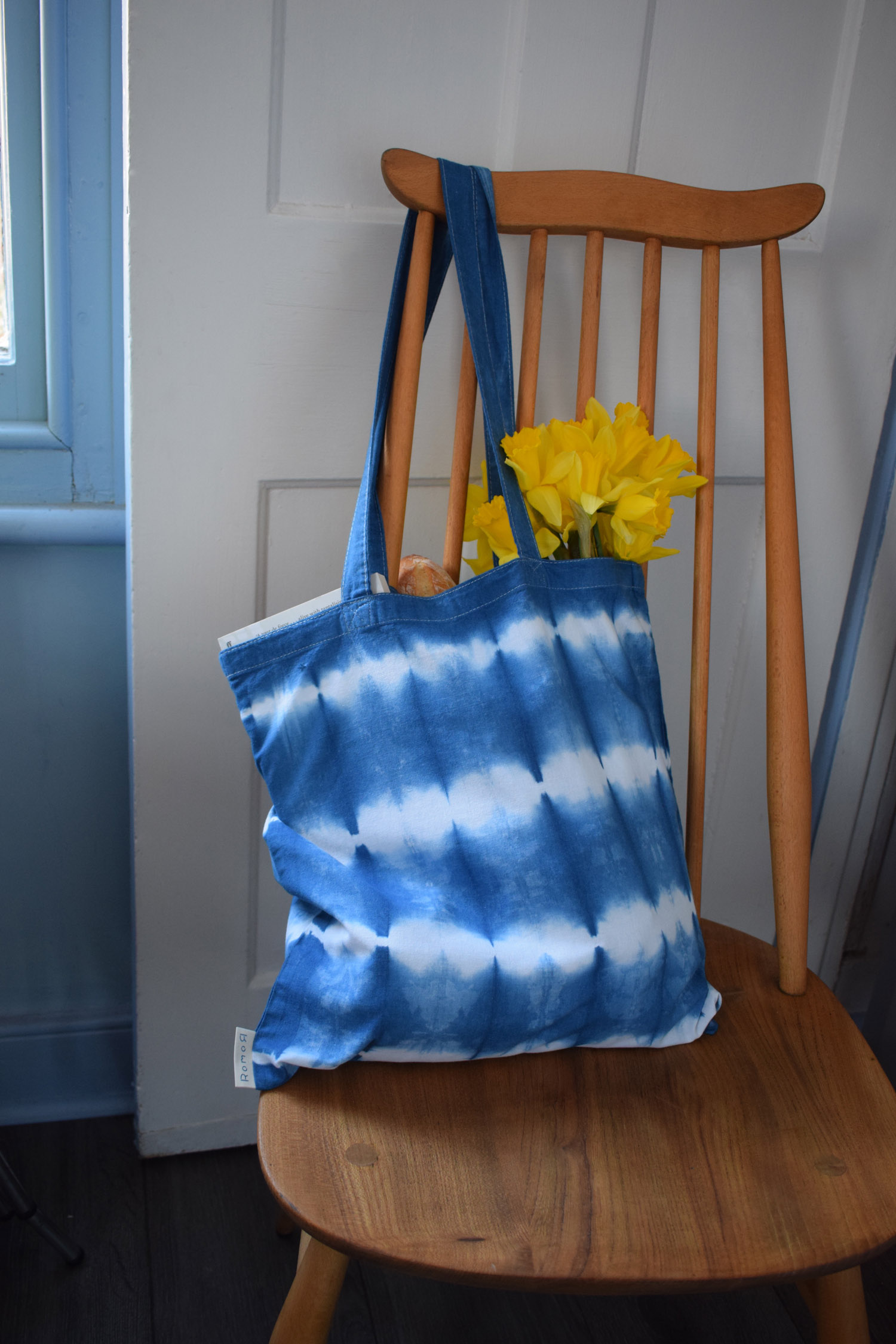Romor Designs indigo tote - GRID - GURRIDO - on chair filled.jpg