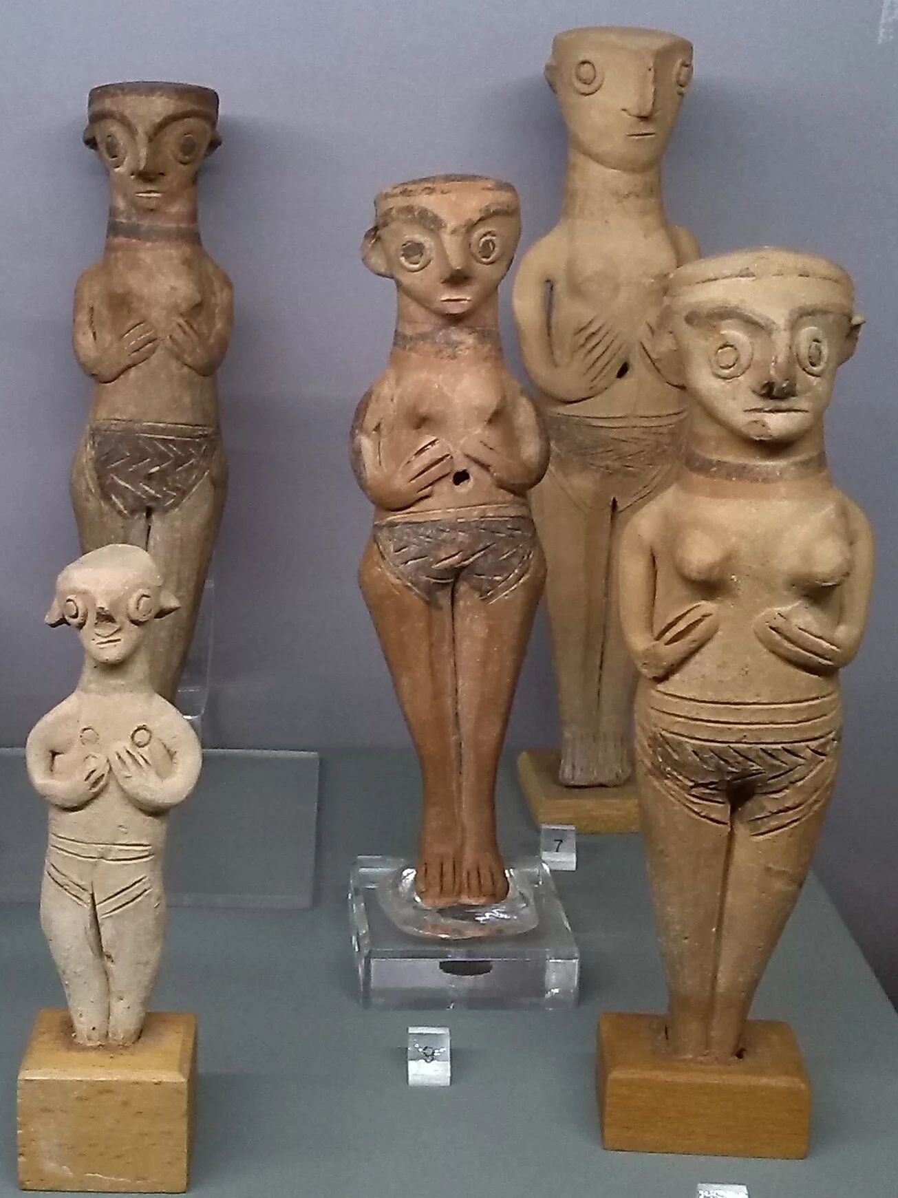 Aphrodite Female figurines with hands under breasts.jpg