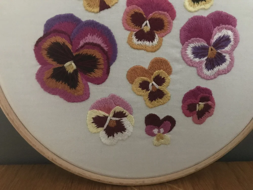 Multiple pansy embroidery using long and short stitch.jpg