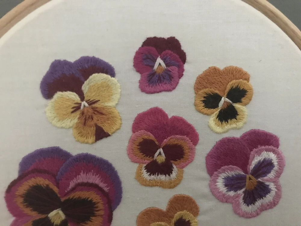 Pansy needle painting hoop art.jpg