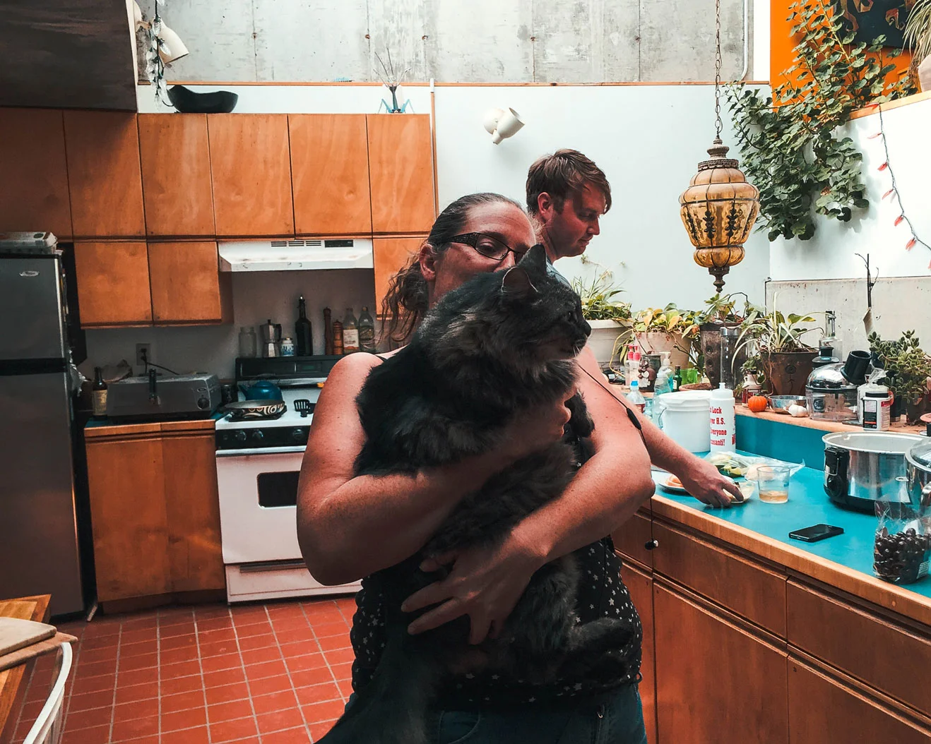 Workshop Coordinator Mel with her cat in one of the larger Arcosanti living spaces