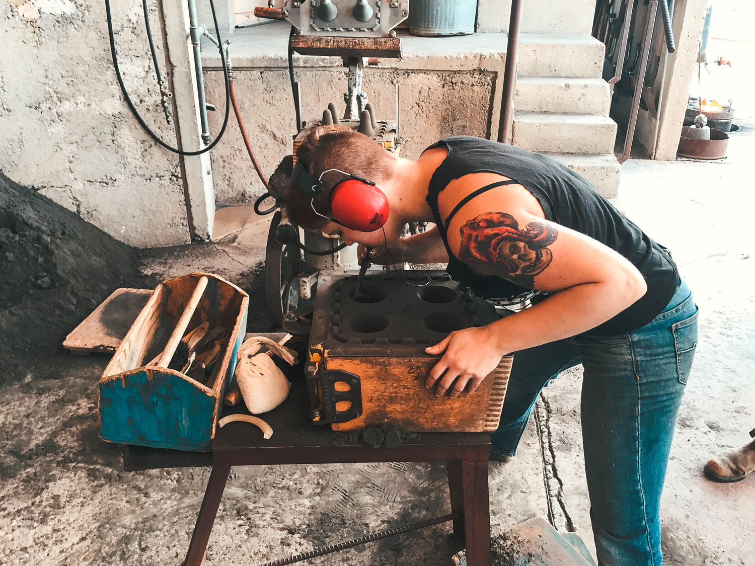 Taylor, one of the foundry's only females, getting the molds ready