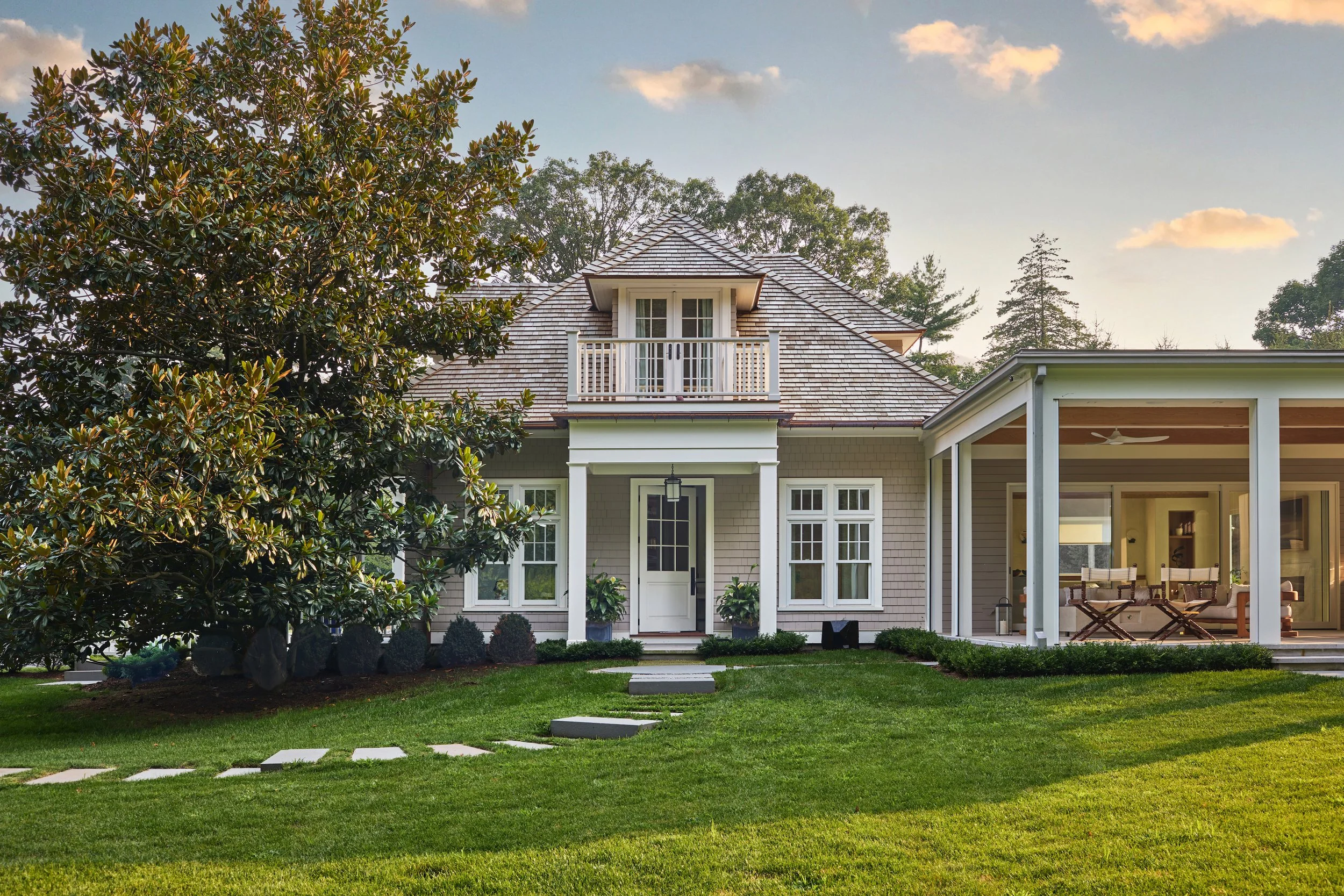 Our modern addition can be seen to the right of the antique guest house. Amy Vischio Photography.