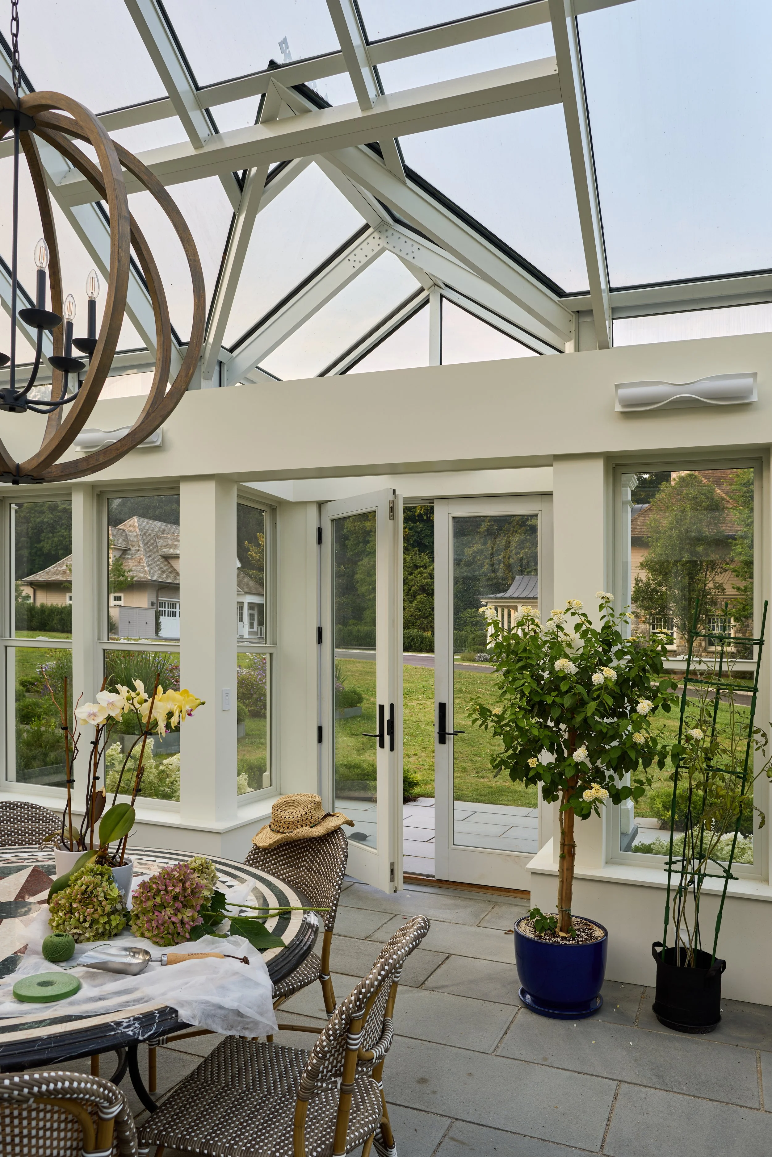  The interior of the greenhouse shows that it is both a working greenhouse and beautiful . Adjustable glass skylights allow hot air to vent,  