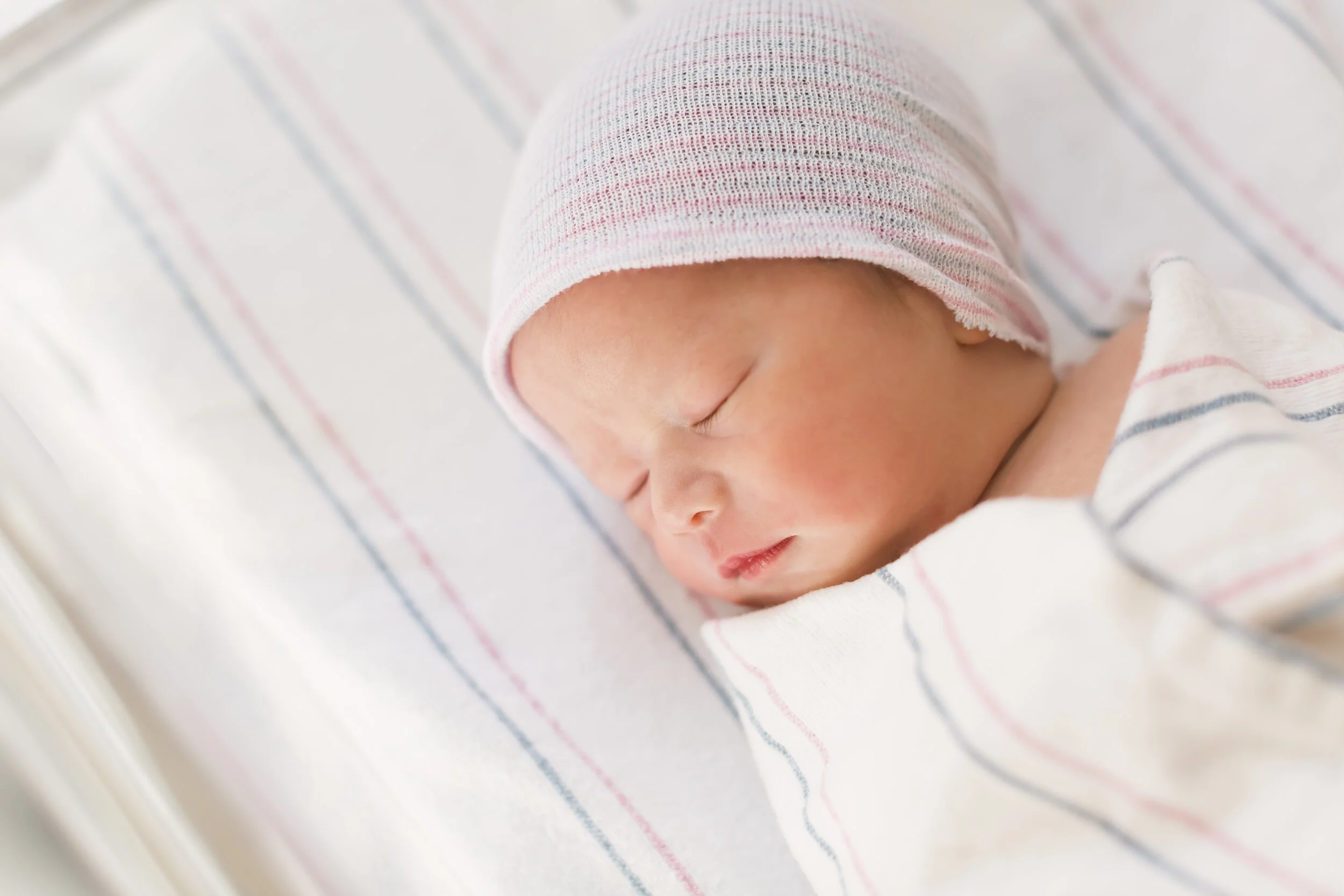 graphicstock-newborn-infant-baby-boy-swaddled-after-birth-lying-in-his-hospital-bed_BPdr62sVOb.jpg