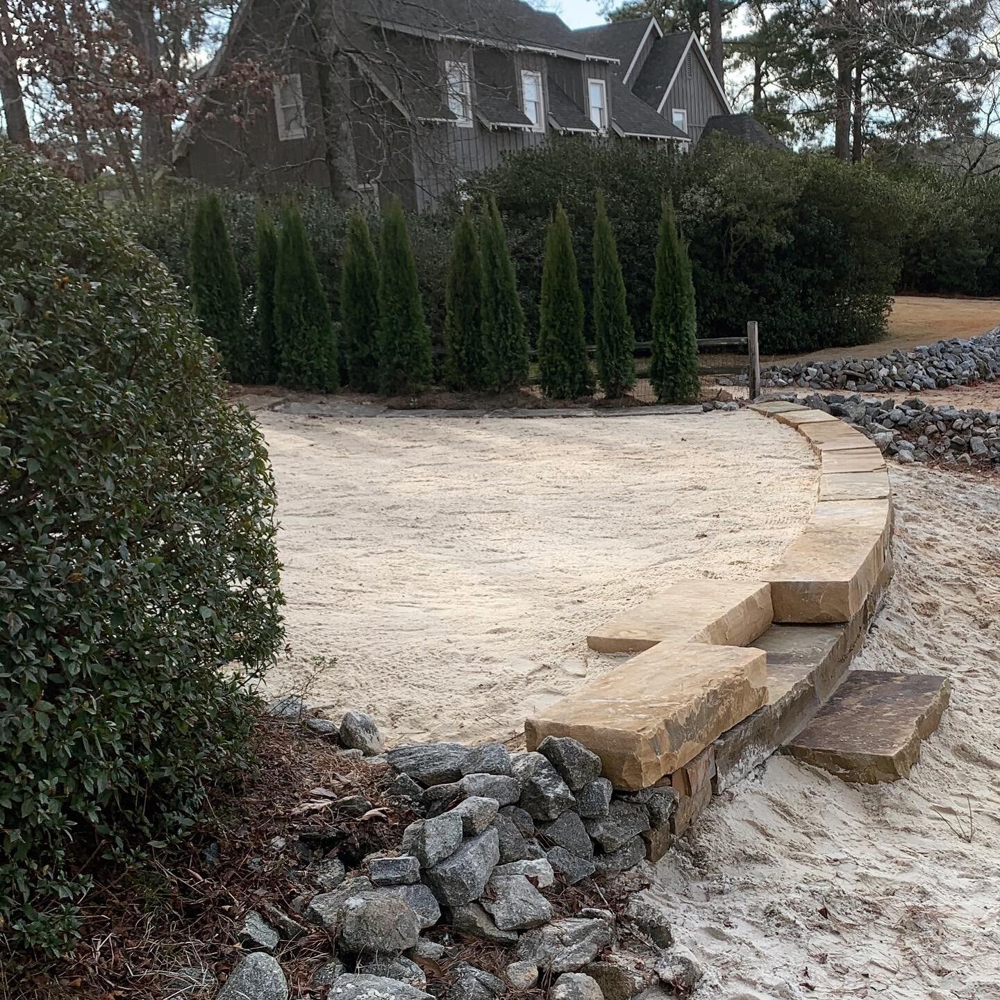 We were able to pour a proper footing and reset this ledge rock retaining wall with a gentle, more aesthetic, contour. Finish with an arborvitae screen and our wonderful clients are beach ready to enjoy another amazing season on Lake Martin.

#ledger