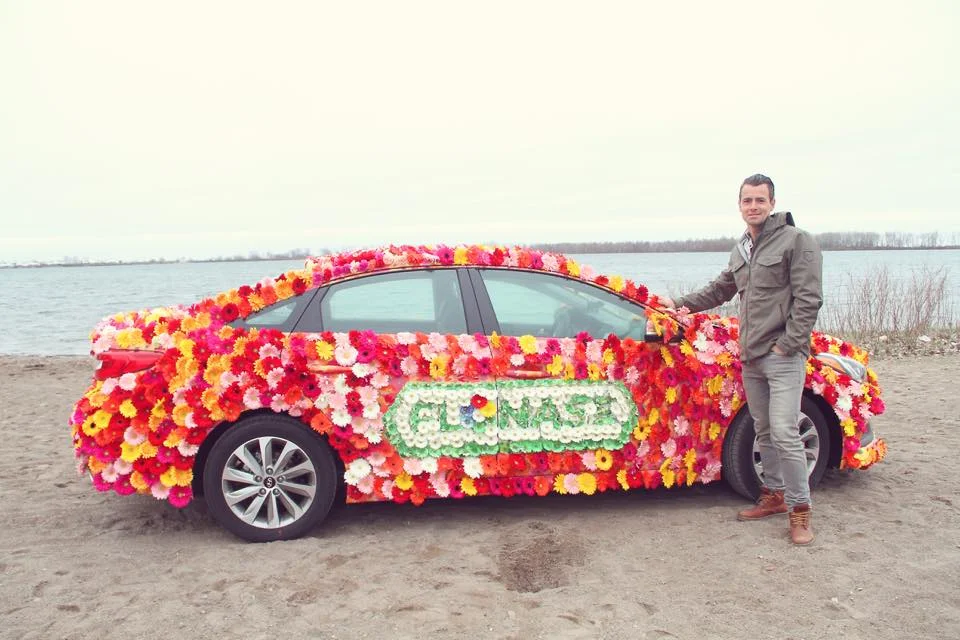 Adam van Koeverden with the Flonase Flower Car