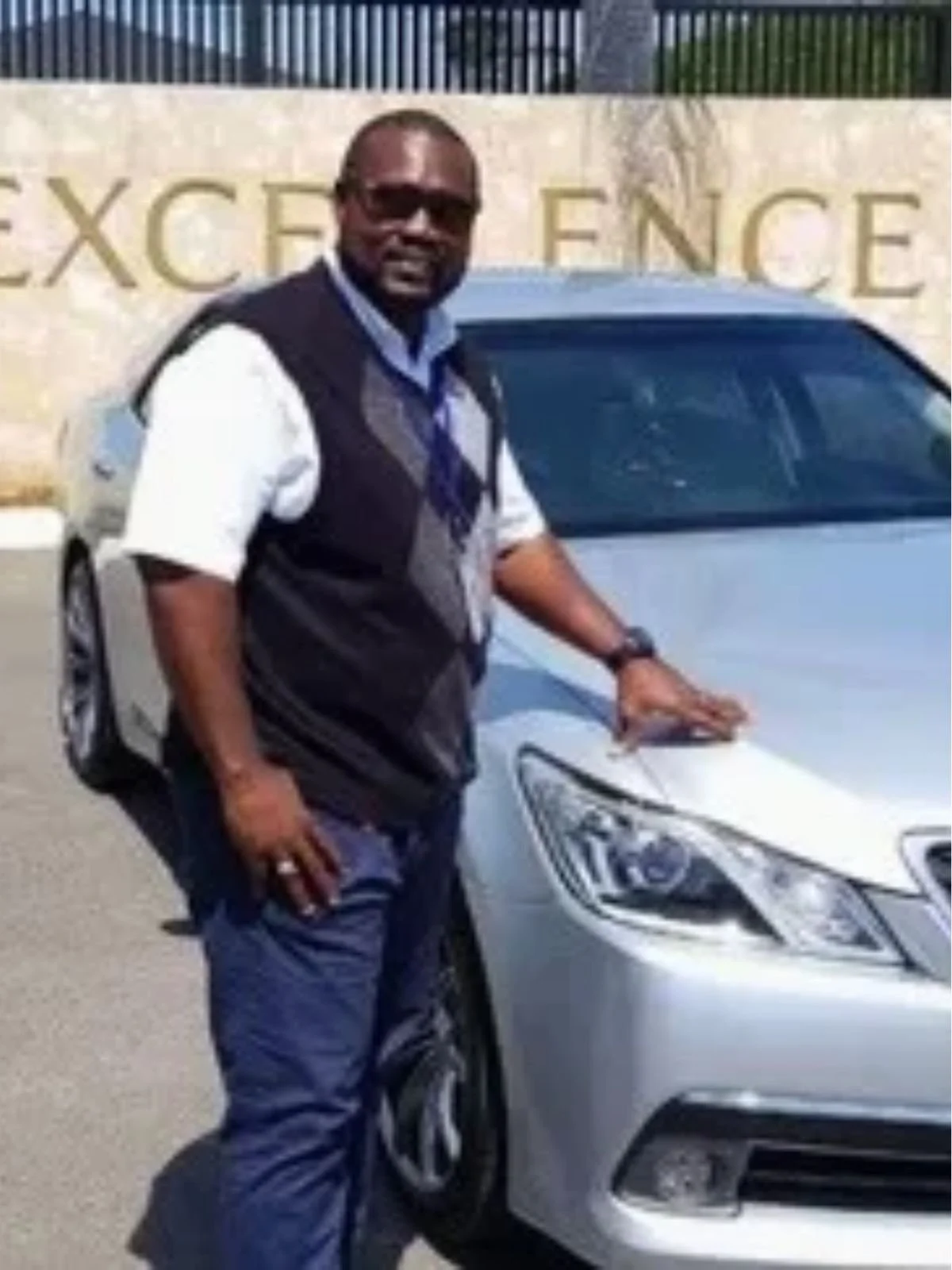 Byron standing beside a vehicle at Byron's Jamaica Tours.