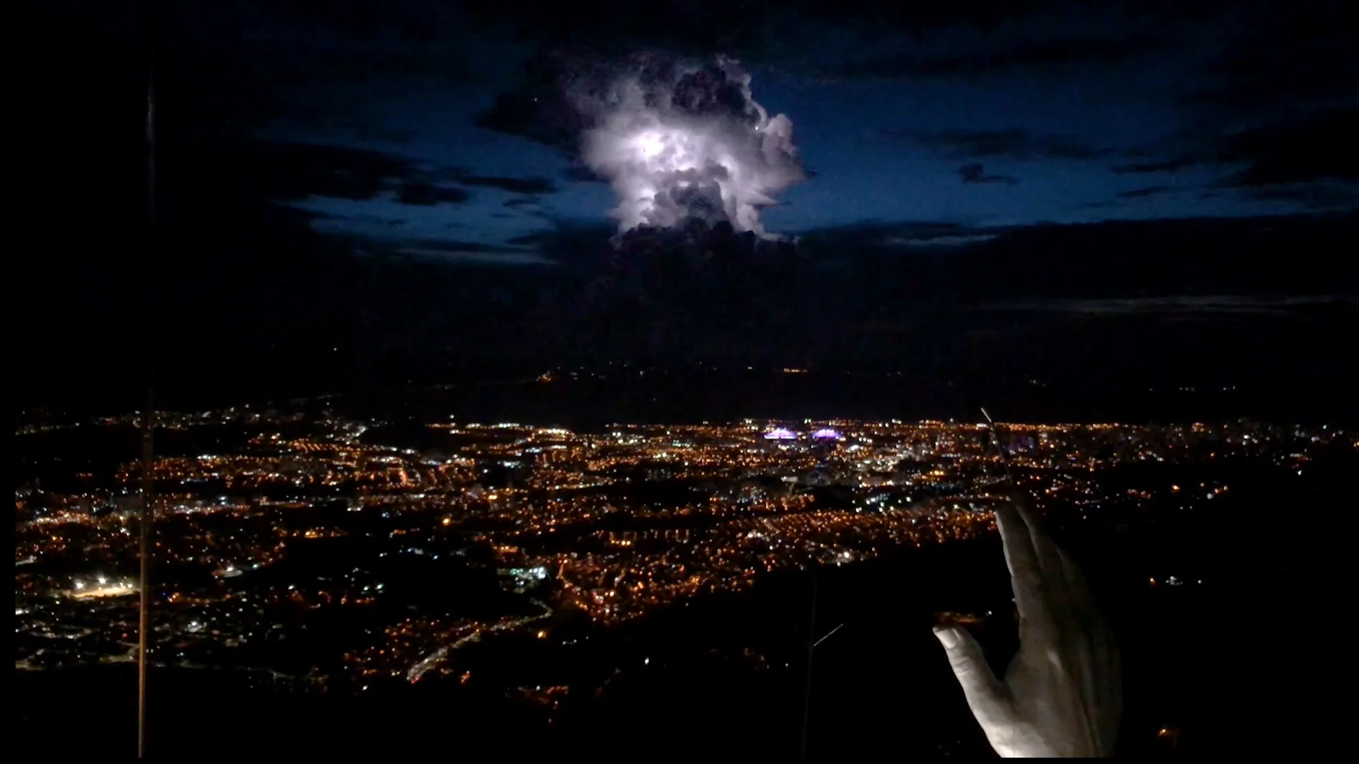 View from the top of the Christ statue at Ecoparque Cerro del Santísimo during a lightning storm.