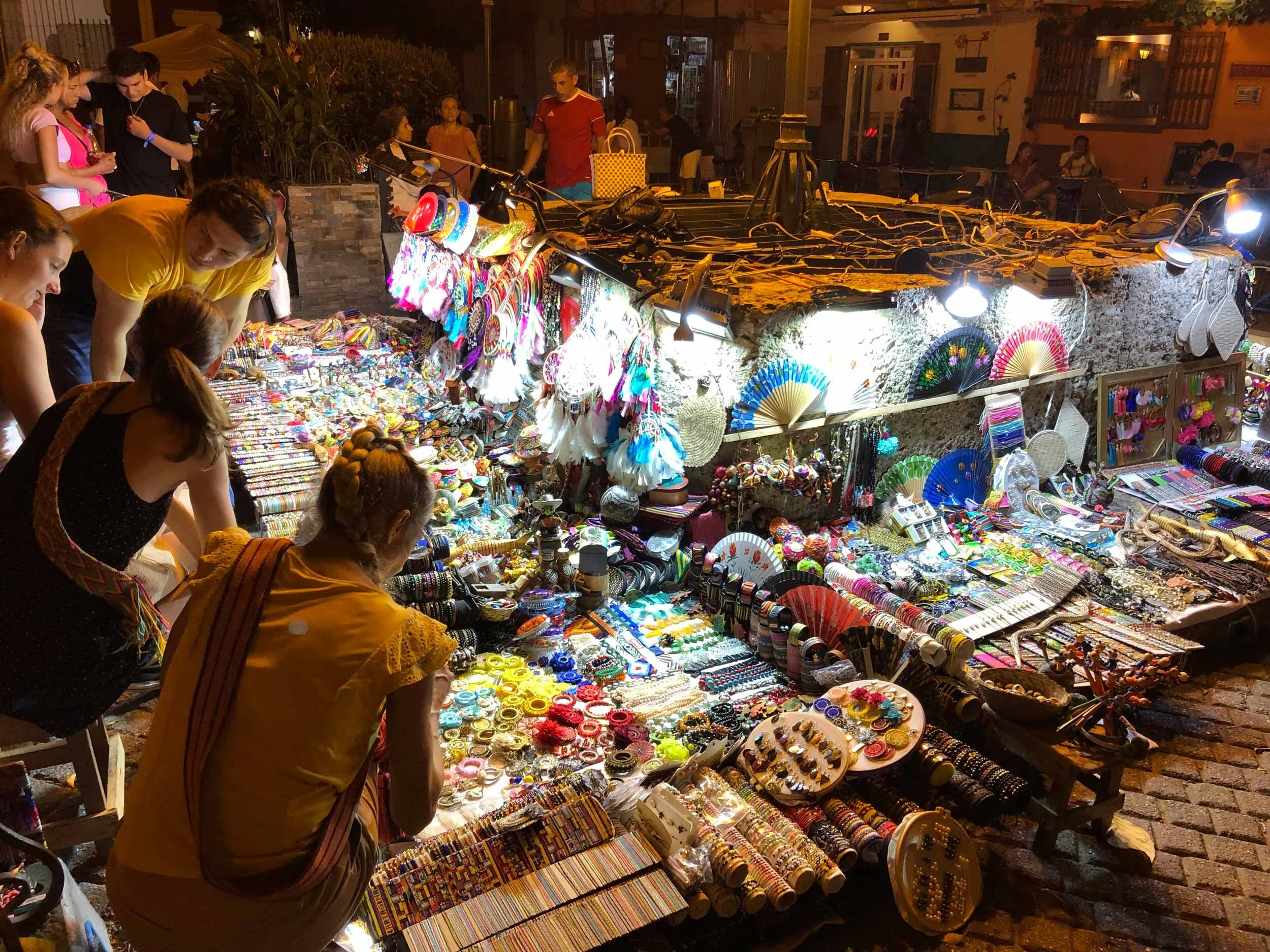 Plaza de San Diego is full of vendors selling hand made bracelets and other treasures after dark.