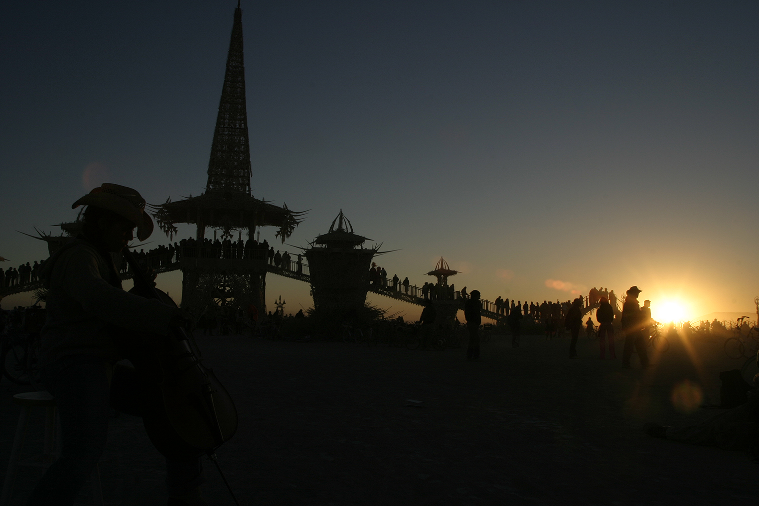 Natalie Nguyen (1/2 Vietnamese, 1/2 Irish) playing cello on Sunday sunrise at the temple, hours before it (the temple) was to be set on fire. BM-2004