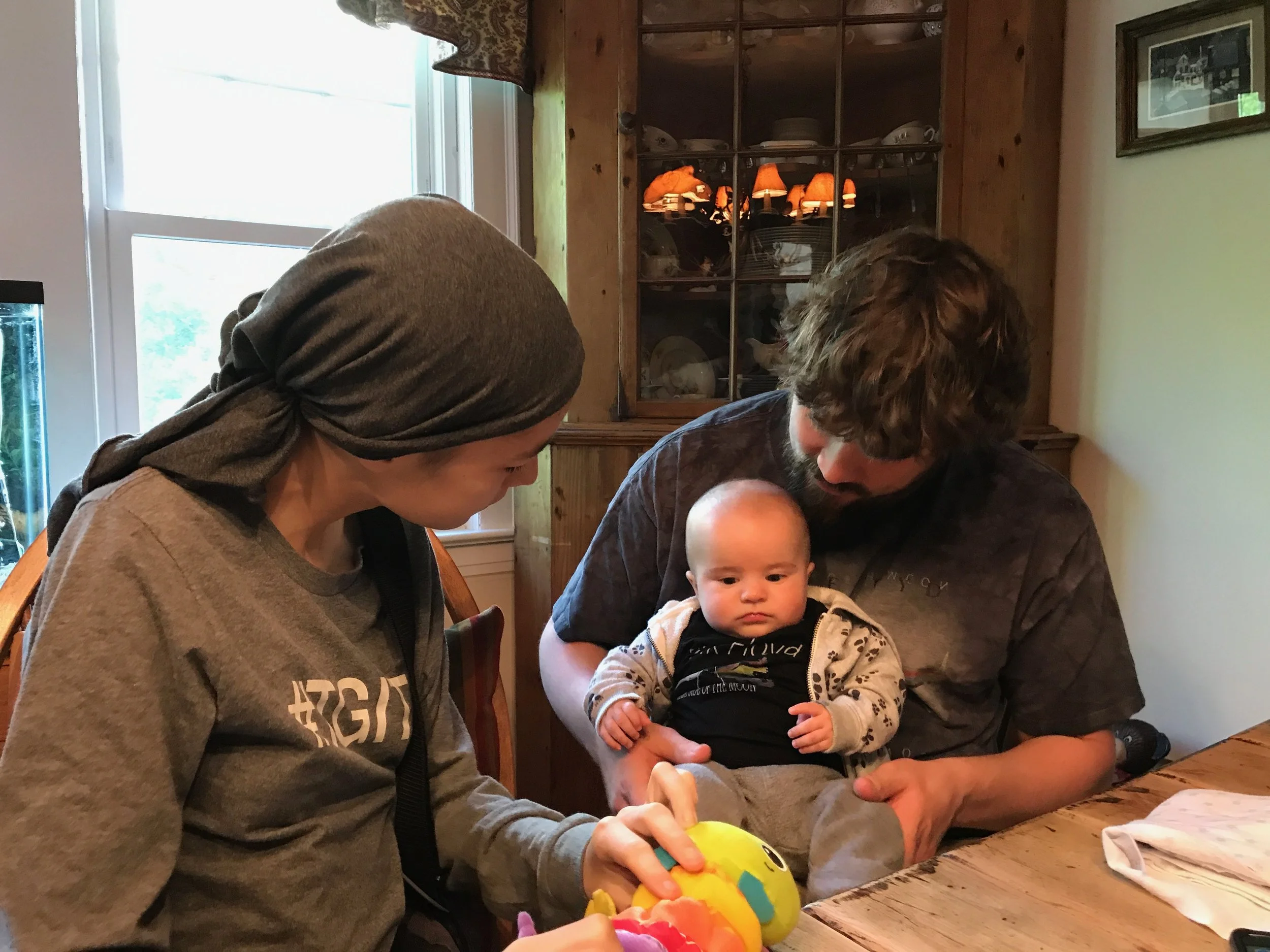 This is Maggie with Mr. Barrett and his son River, after gifting him with the signed Red Hot Chili Peppers Getaway Album.