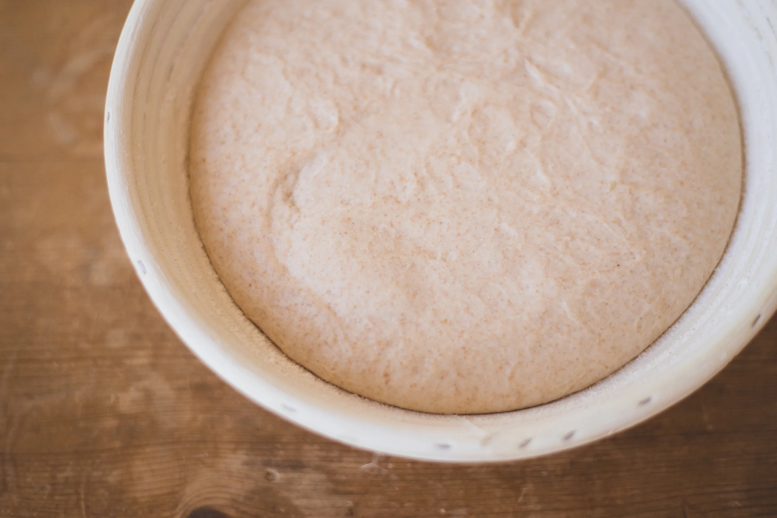 Dough should be significantly puffier than before and have some large bubbles in it.