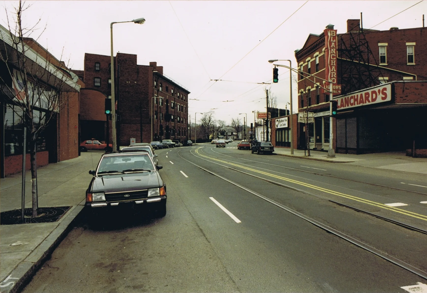 Centre St looking South toward Monument showing Brigham’s and new fire station on left at 736-746 Centre St., and Blanchard’s Liquors, Mr. Fowler Realtors, Boston Five Cents S.B., & Dunkin Donuts on right at 741-753 Centre St., 1993