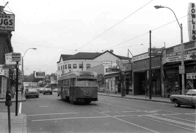 Centre & Burroughs Streets are the location for this 1960s photo showing trolley # 3043 on its journey to the Arborway. The local merchants were Boston Five Cent Savings Bank, Yumont Paint & Supply, Publix Market, F.W.Woolworth, and Rogers Drug Store. 