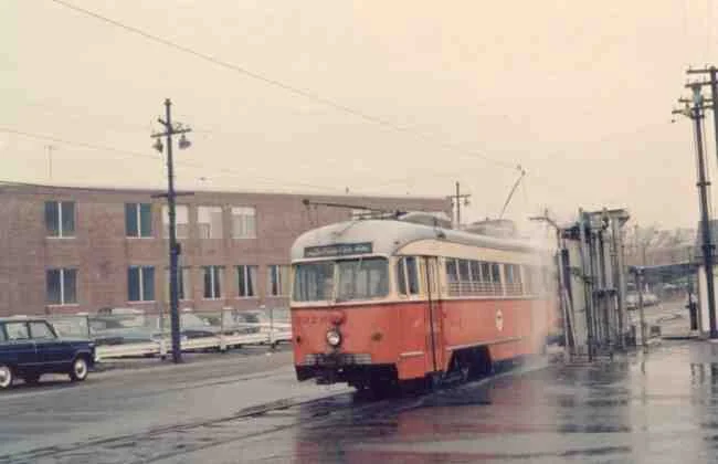 Trolley # 3326 is shown here in this 1967 photo at the Arborway yard getting a trolley wash. It appears that the machine goes around the trolley with a high pressure washing system.