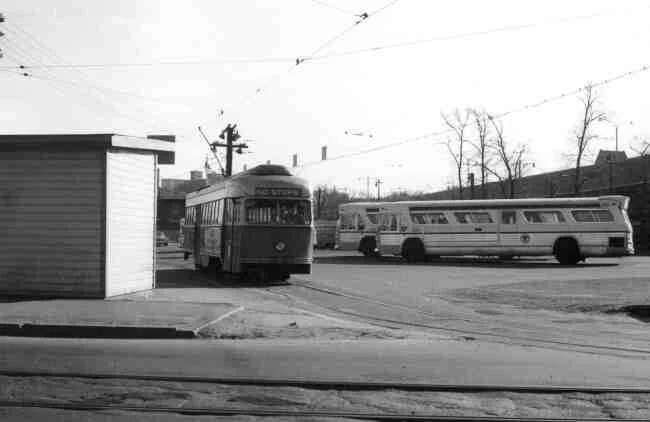 Trolley # 3229 is shown departing from the Arborway yard onto Washington Street in this late 1960s photo. The passenger shelter facility can be seen along with a few parked buses.