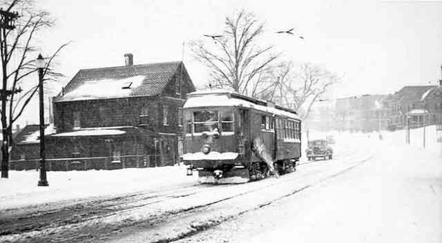 Trolley on wintry street run, 1965