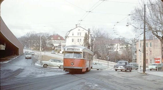 A trolley turning from South Street towards Forest Hills Station in 1960.