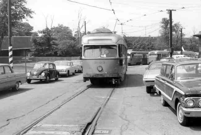 Trolley # 3103 rests idly along side the Arborway MBTA office in this late 1960s photo. 