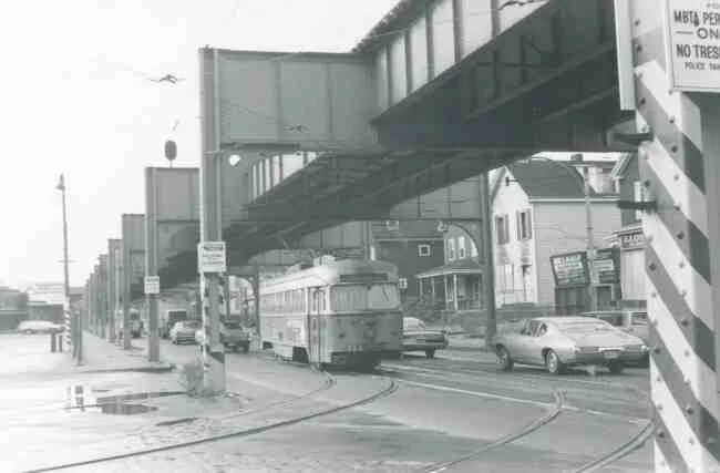 Trolley # 3323 begins its entrance into the Arborway trolley yard in this 1969 photo taken on Washington Street. One of the businesses that can be seen is John McAulay Aluminum Doors and Windows. 