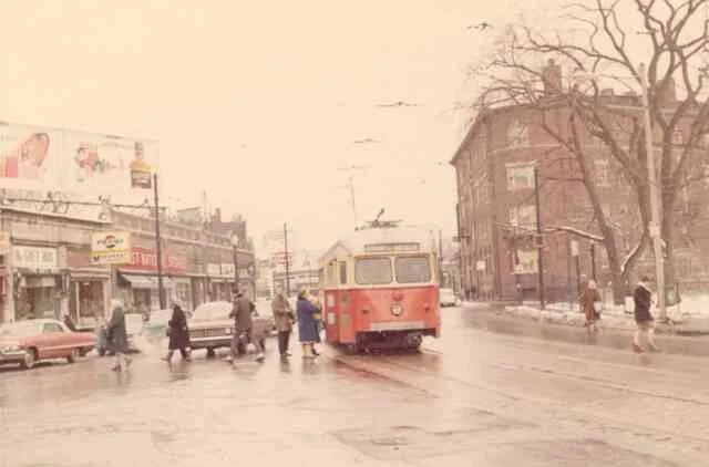 Passengers can be seen boarding trolley # 3322 on Centre Street near the Monument on this snowy day in 1967. Some of the businesses were the local First National Grocery Store, Monument Luncheonette, The Gift Box, The Telephone business office, and the Atlantic gas station on the corner of Thomas Street. 