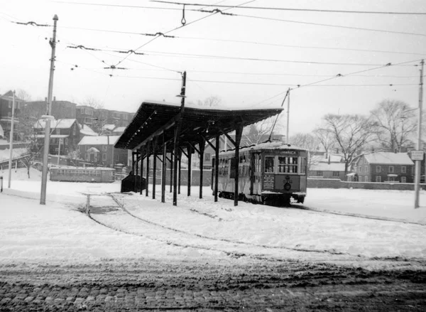 Car 5711 has taken on passengers at the Jamaica Station (Loop), where the old carhouse had been located, and prepares to begin its return trip. This photograph was taken in December 1939. Housing on Woodman Street, Ballard Way, and Jamaica Street can be seen in the background. Note the coblestone surface of South Street in the foreground. This was the end of the line from Dudley.