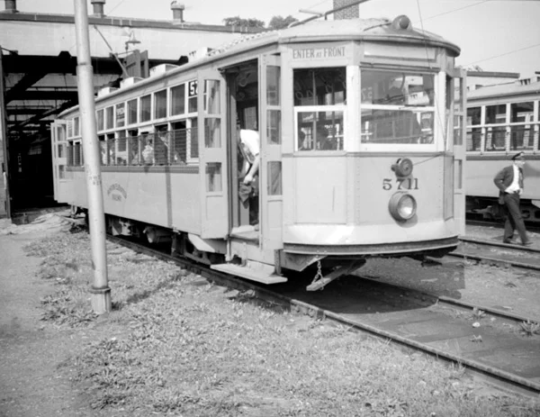 5711, seen in front of the Arborway carhouse is a 'Type 5'; a very light, but large car which saw heavy use all over the system. There were 471 of these cars and they are among the most often restored of all custom-made American streetcars. There is a 'Type 5' currently resident in Boylston Station. That car originally did its tour of duty on the Arborway line. November 7, 1941.