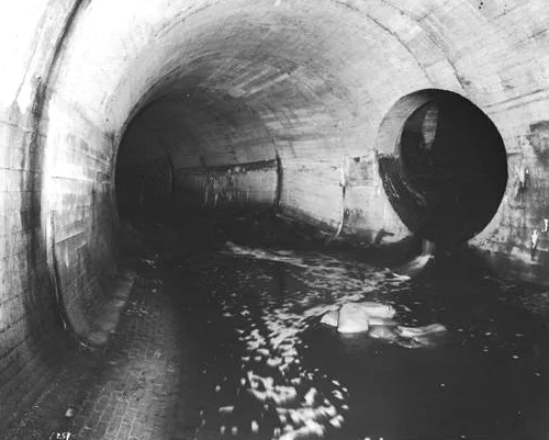 A portion of the system of tunnels that carry the Stony Brook from its origin in the Stonybrook Reservation in West Roxbury to the point where it empties into the Charles River. This undated photograph was taken under Amory Street in Jamaica Plain and is provided courtesy of the Boston Water and Sewer Commission.