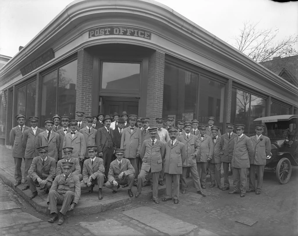 U.S. Post Office staff pose in front of the post office at the corner of Cheshire and Green Sts. Courtesy of Boston Public Library.