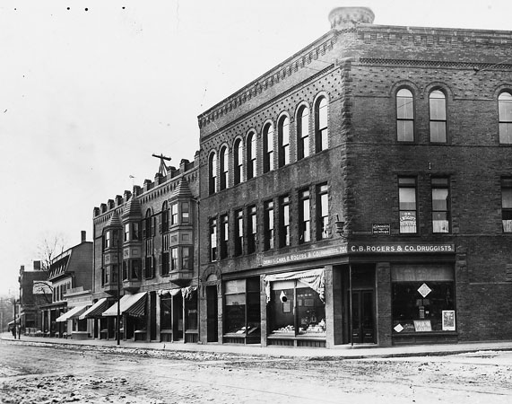 701 and 703 Centre St. at the corner with Burroughs St. At the turn of the century this building housed C.B. Rogers & Company pharmacy and it remained in that use through the mid-1970s.