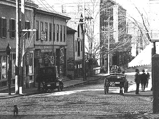 A 1906 view looking down Green St. towards Amory St. Washington St. crosses in the foreground. Current addresses shown in this view run from 171 to 209 Green St.
