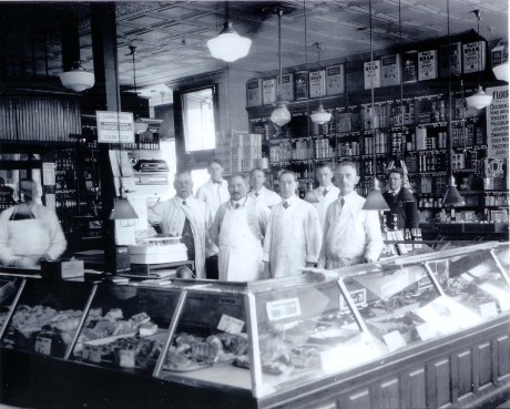  Employees of Patterson’s Market on South St.&nbsp; John W. Patterson stands next to the scale. George Porter is shown second from right and Josepth Patterson third from the right. Photograph provided courtesy of the Patterson family.&nbsp; A higher 
