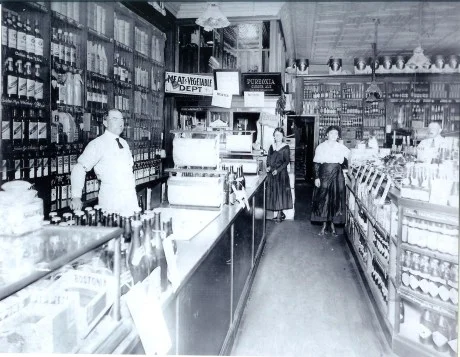 Employees of Patterson’s Market on South St. Photograph courtesy of the Patterson family. The two women shown in the middle are Alice and May Patterson. A higher resolution version of this photograph is available .