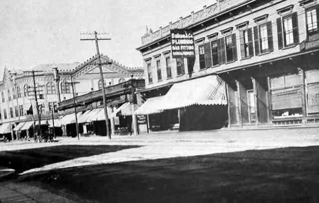 A view of Centre St. looking north towards Seaverns Ave. A plumbing and gas fitting service is seen on the right. circa 1900-1920. Courtesy of the Jamaica Plain Branch of the Boston Public Library.