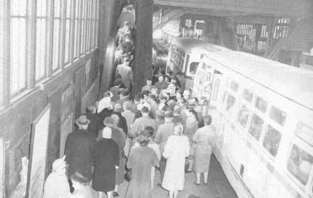 Buses unload passengers on the lower level of the Forest Hills Orange Line station in 1960. Courtesy of Anthony Sammarco.