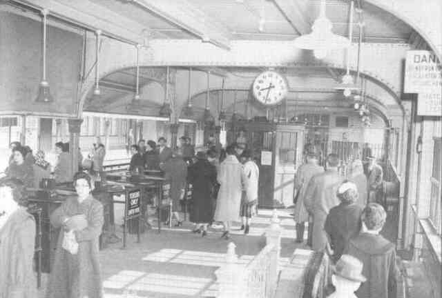 This photograph captures early morning activity inside the Forest Hills Orange Line station in 1960. Courtesy of Anthony Sammarco.