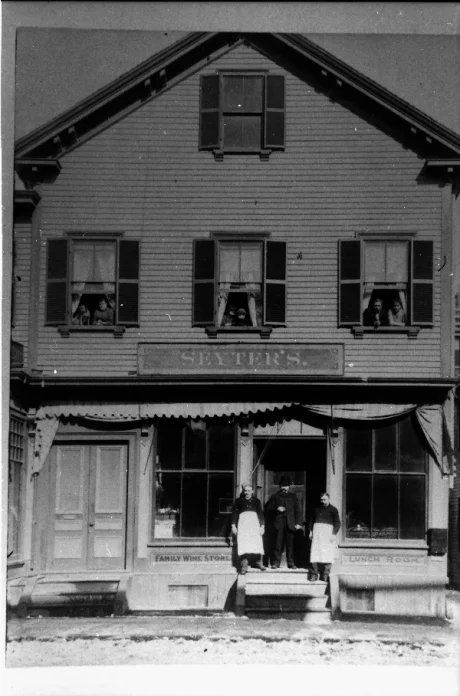 Exterior of Seyter store located in the vicinity of Boylston Station, Jamaica Plain. The sign below the window on the left reads, “Family Wine Store”. Photograph courtesy of Emy Thomas. Higher resolution versions of photographs in this set are available .