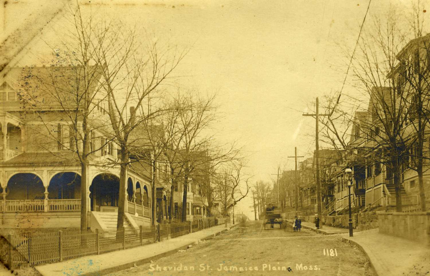  Sheridan Street as viewed from Centre Street. Note the horse drawn wagon, children and gas lights. Courtesy of Greg French. 