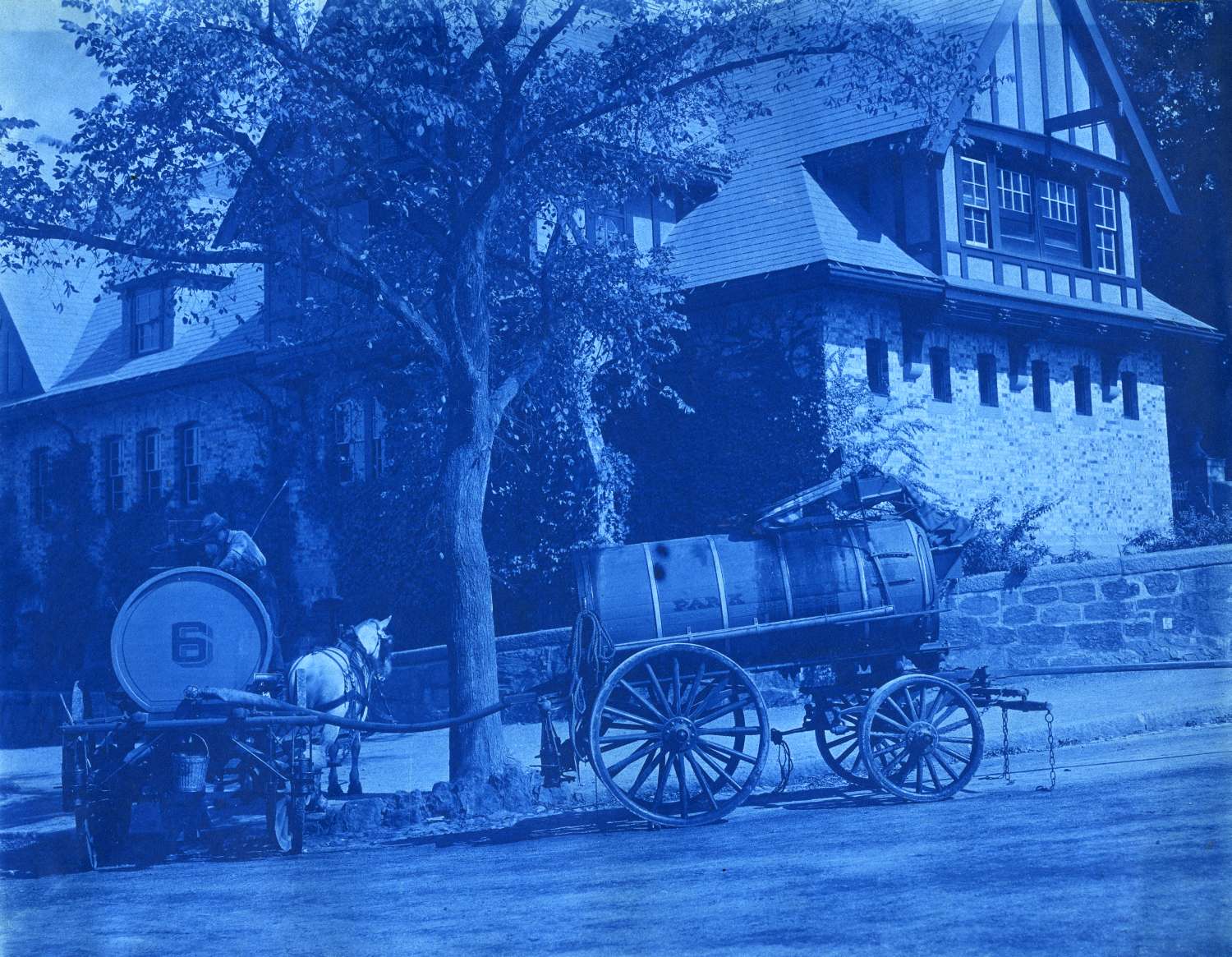  A cyanotype showing two horse-drawn oil sprinkler carts at the corner of the Jamaicaway and Perkins Sts.&nbsp;September 26, 1906. Courtesy Greg French. 